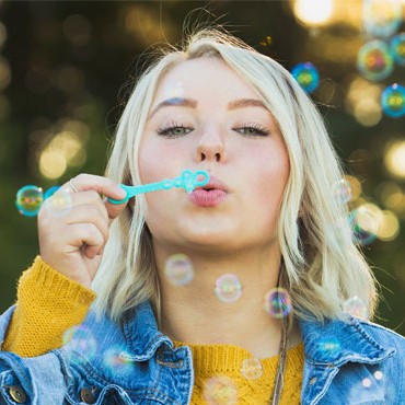 Female Influencer Blowing Bubbles